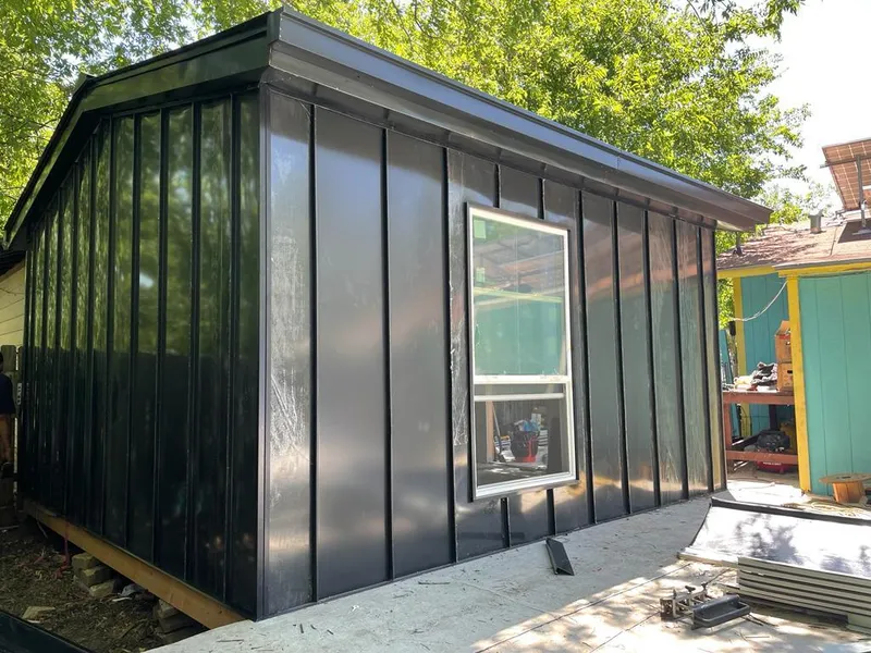 Black standing seam metal wall panels for Roof Inspection in Prairieville